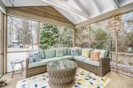 Spacious screen porch is just off the dining room
